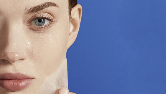 Woman applying a face mask