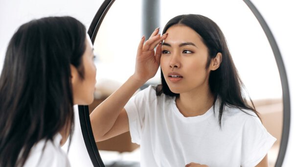 Woman in front of a mirror